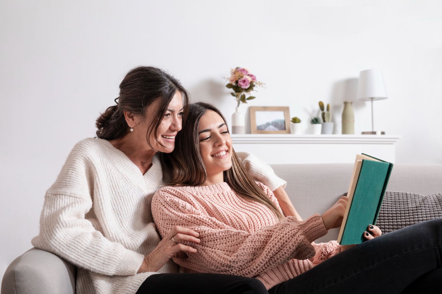 Mother and daughter at home reading