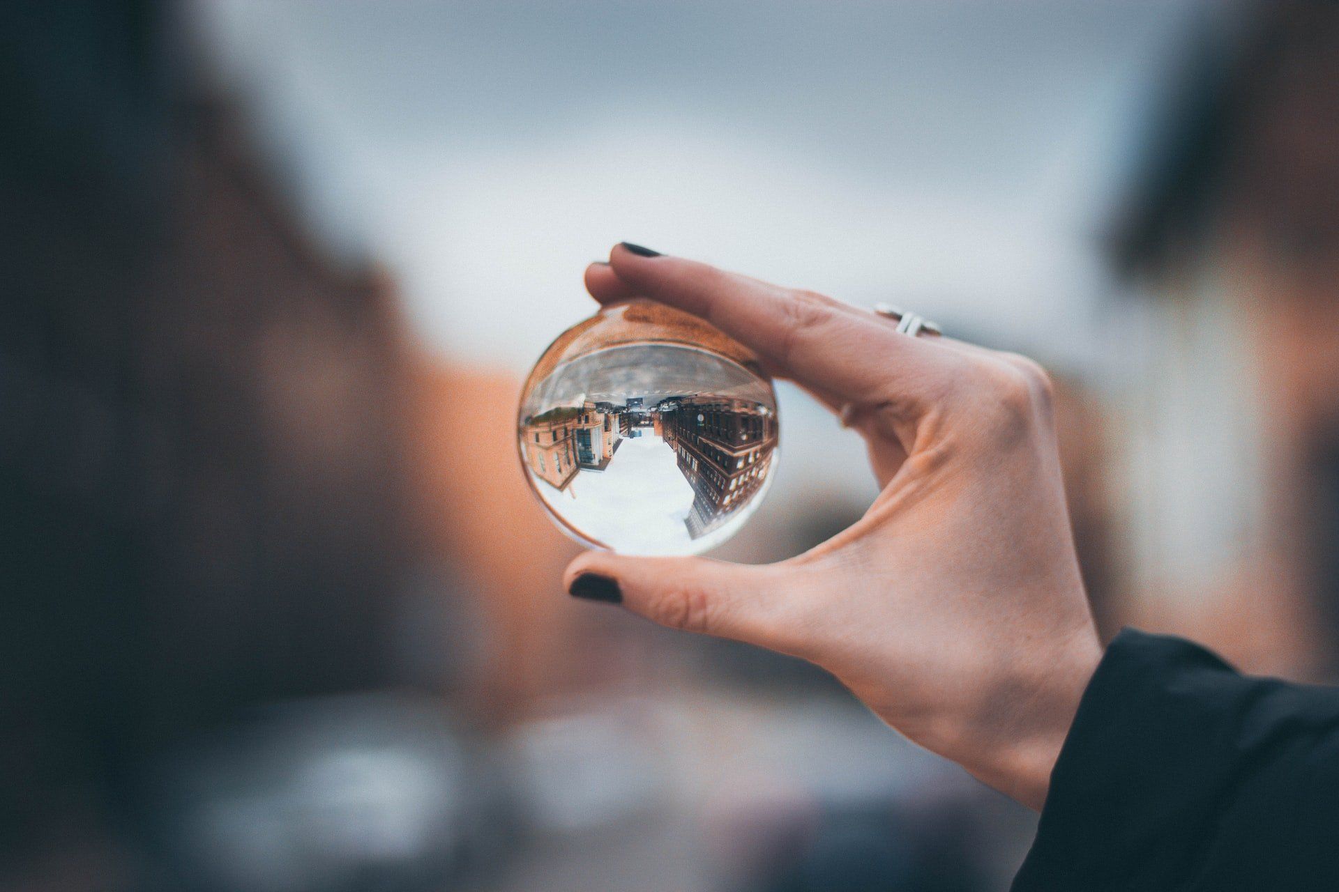 A woman's hand holding a crystal ball (Leadership Perspective)