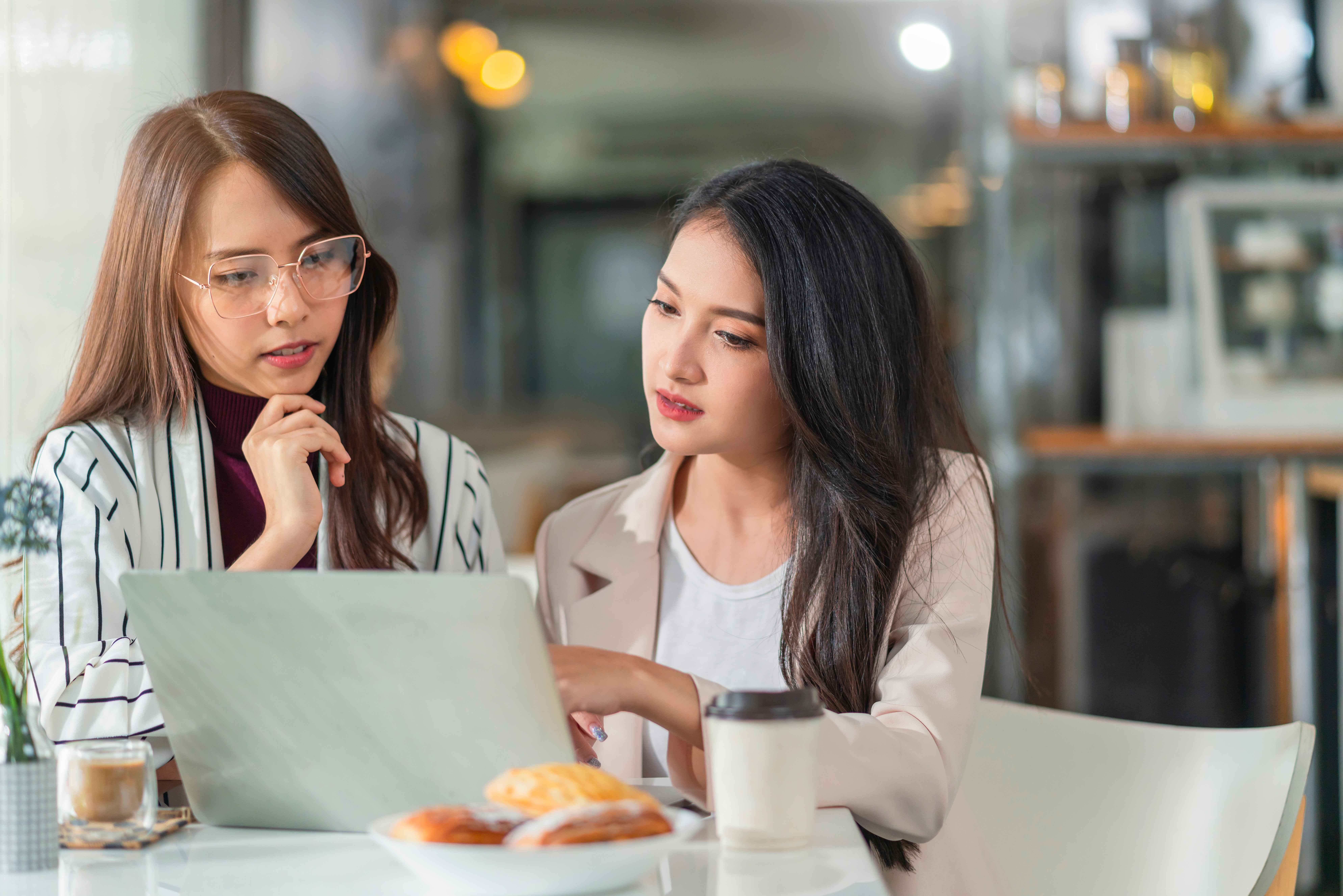 young women discussing about work