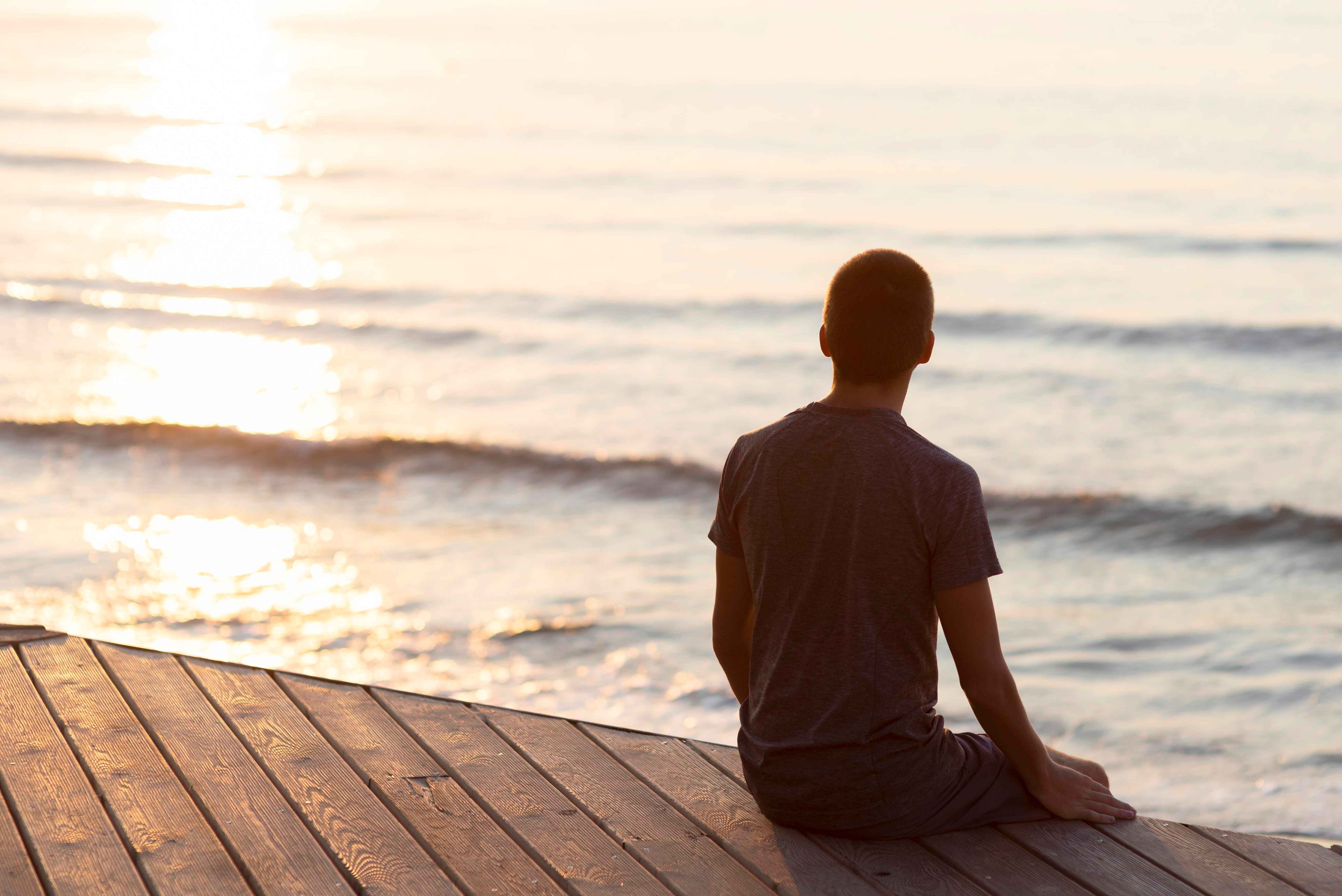 man relaxing by the beach