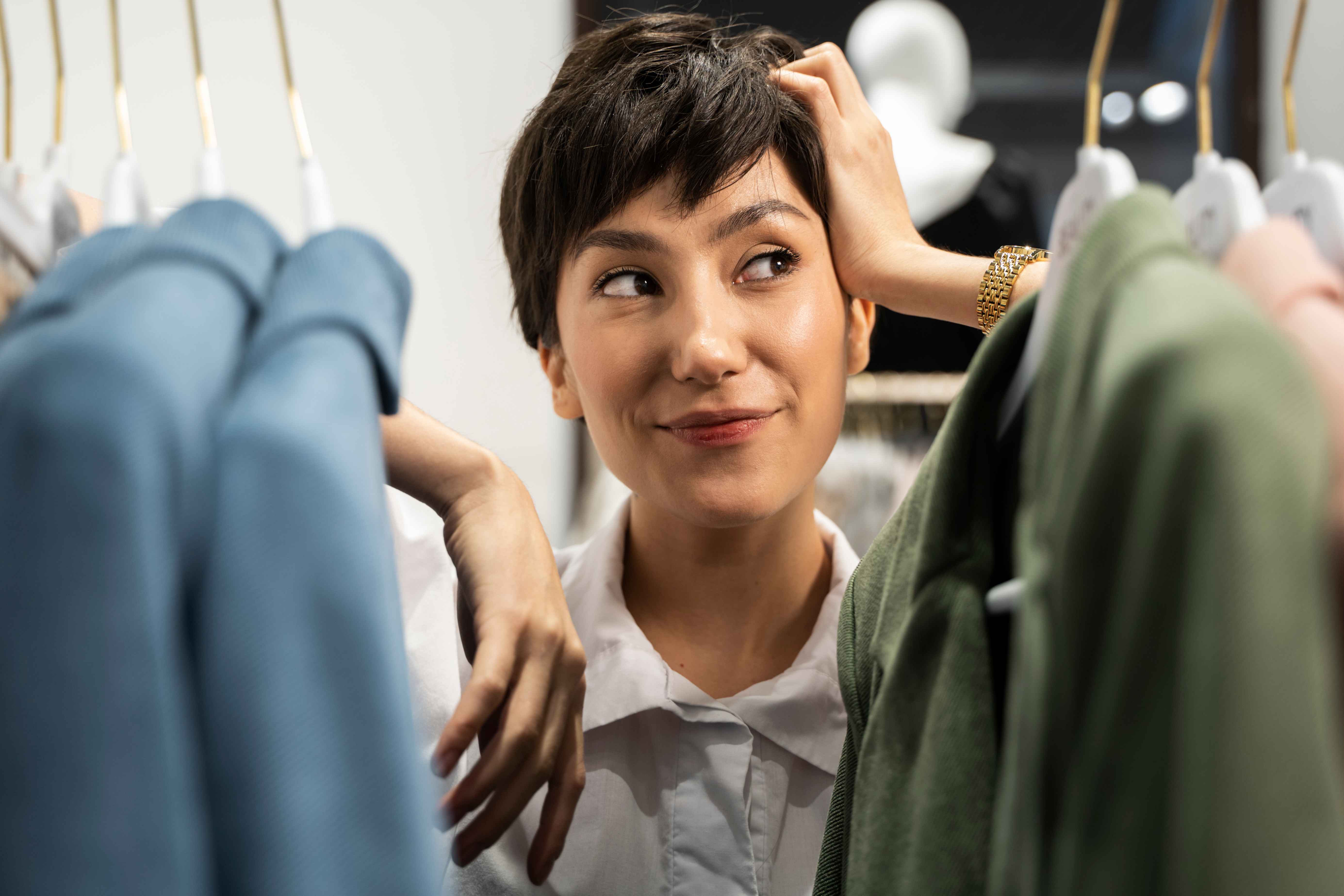 young woman with short hair shopping for clothes