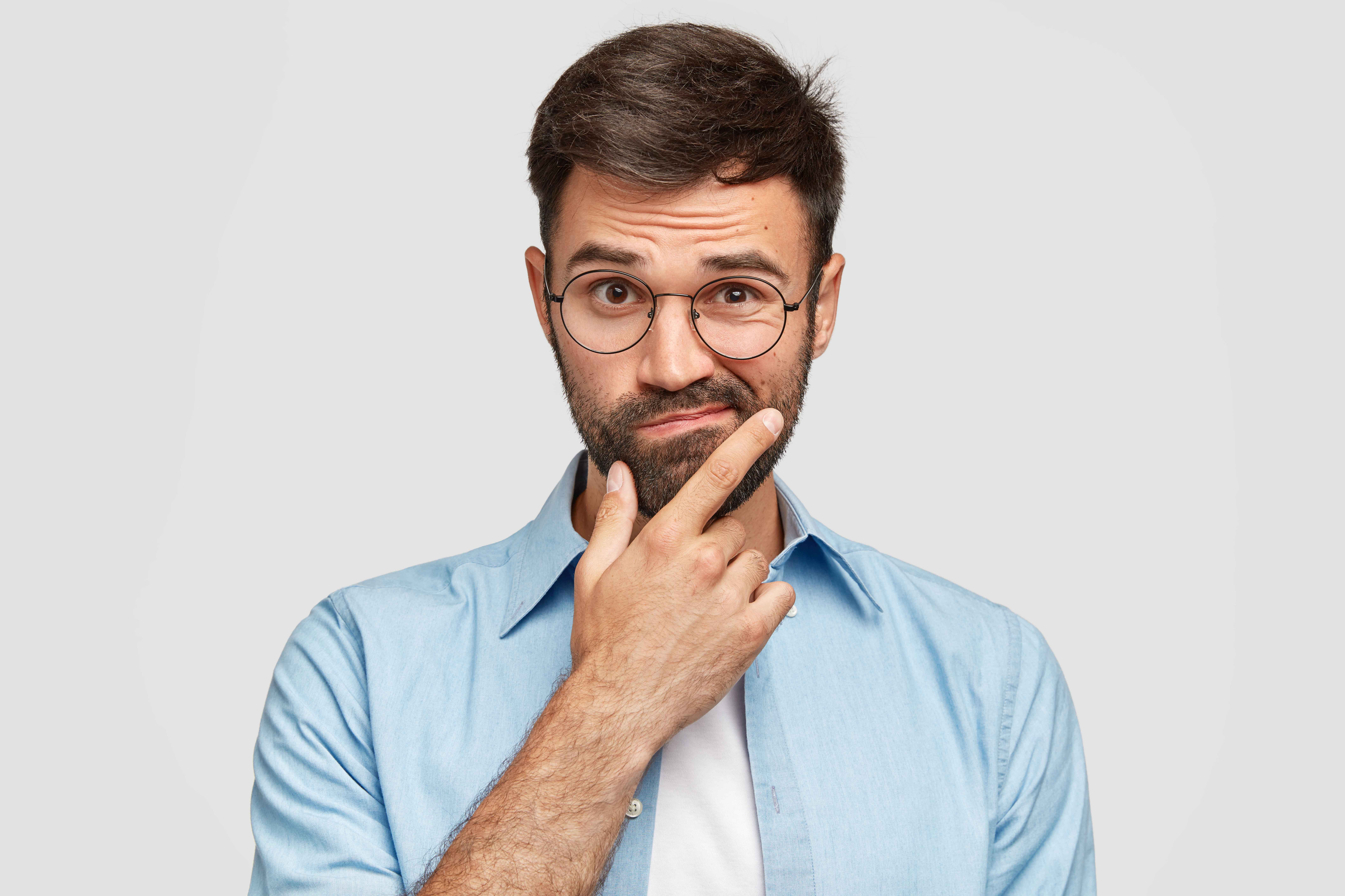 man in a blue shirt with white background