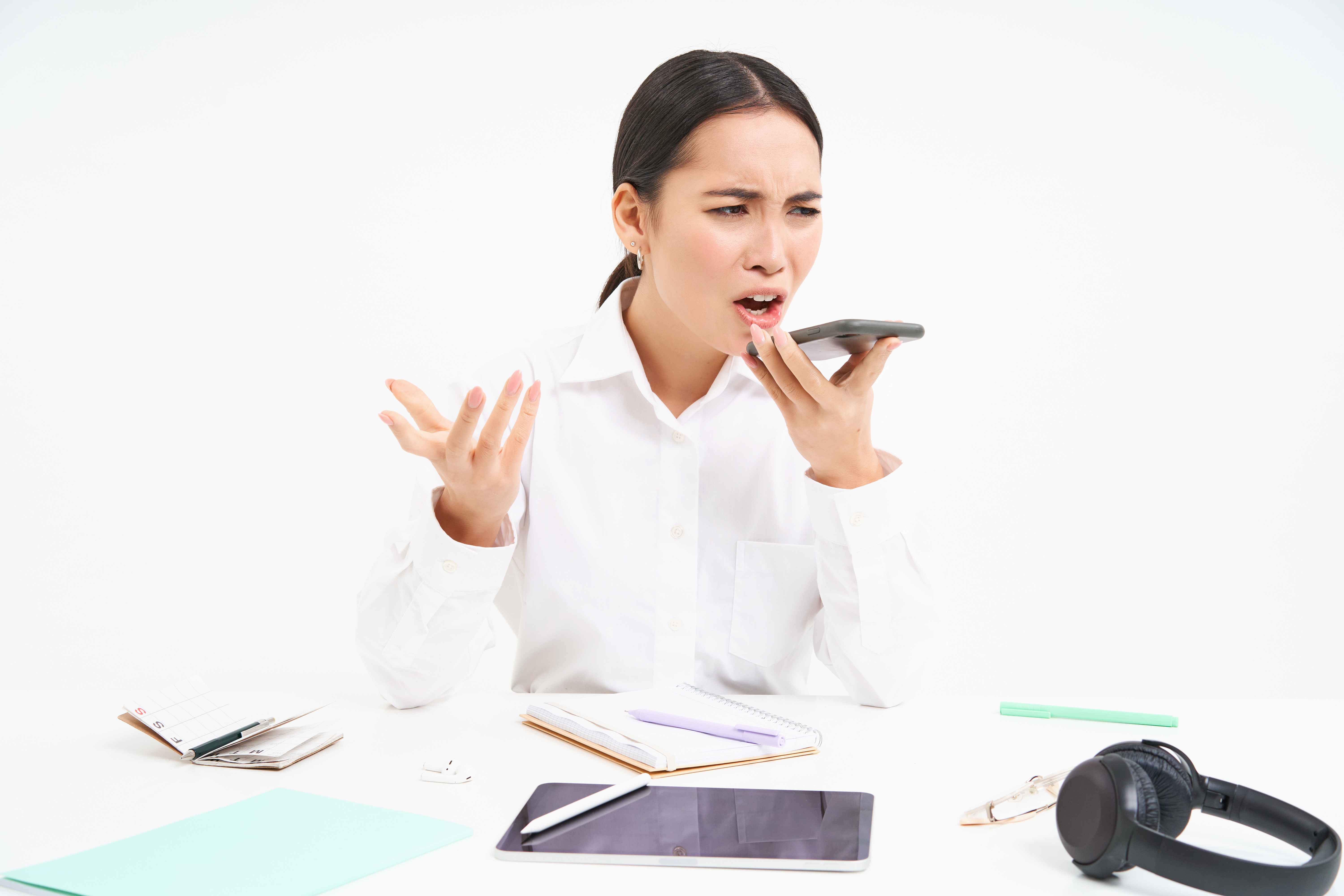 lady in business suit complaining on the phone