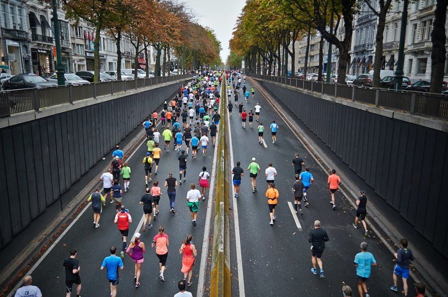 Group of people running a race (finishing the race)