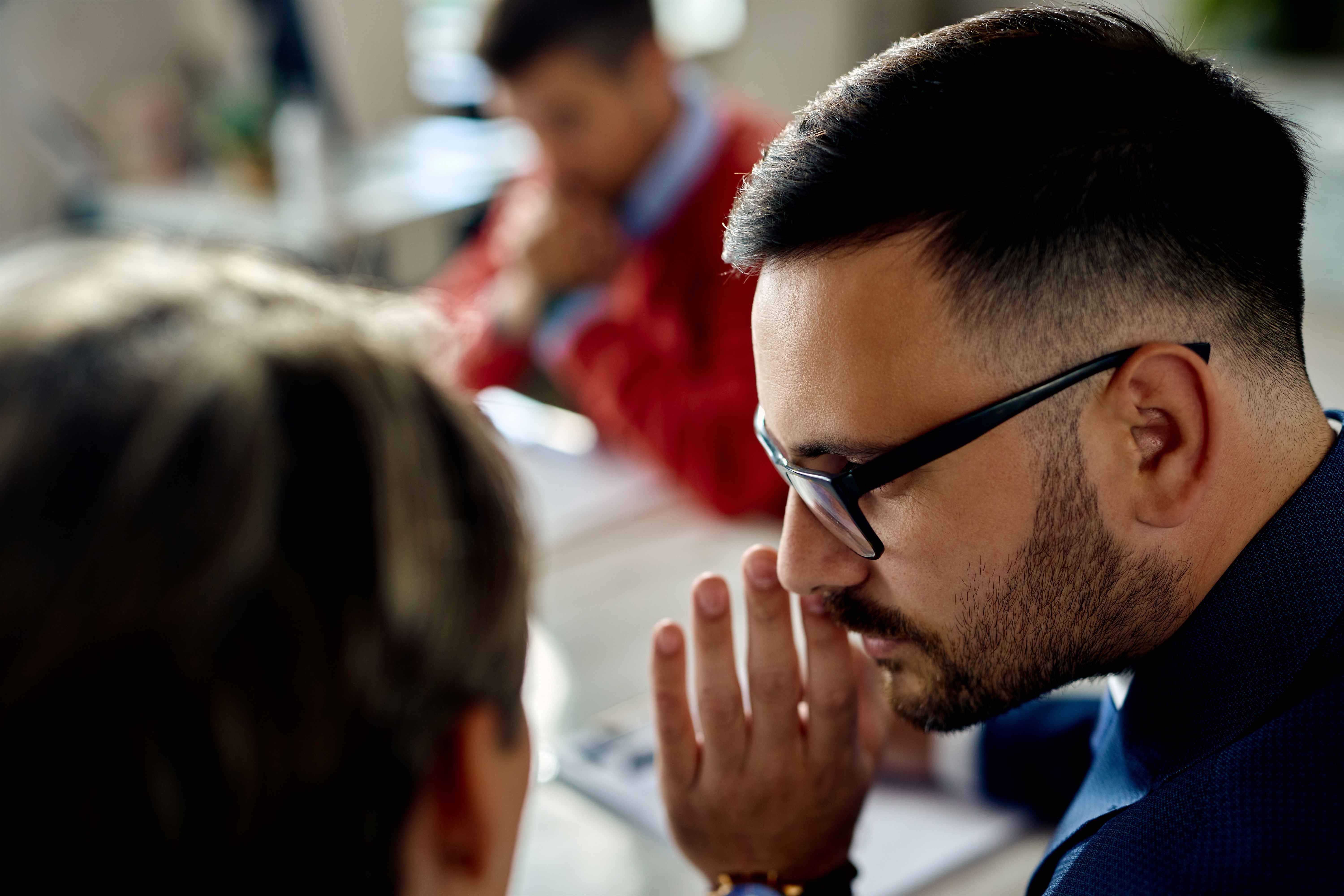 whispering during client meeting