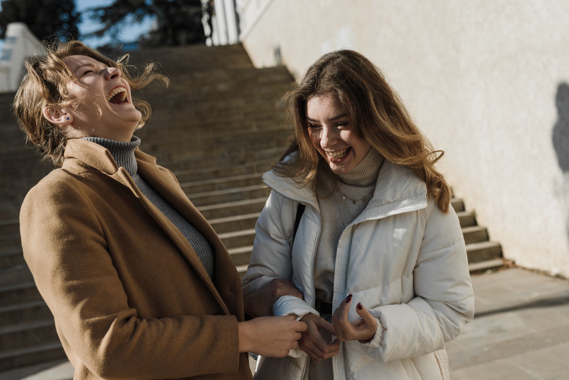 Two women laughing together