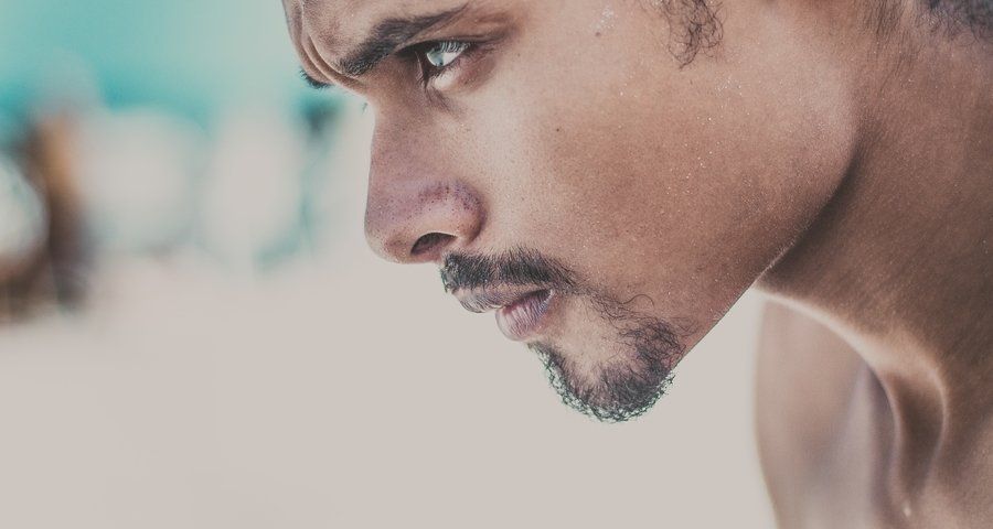 Close up of a man's face looking focused (Grit)