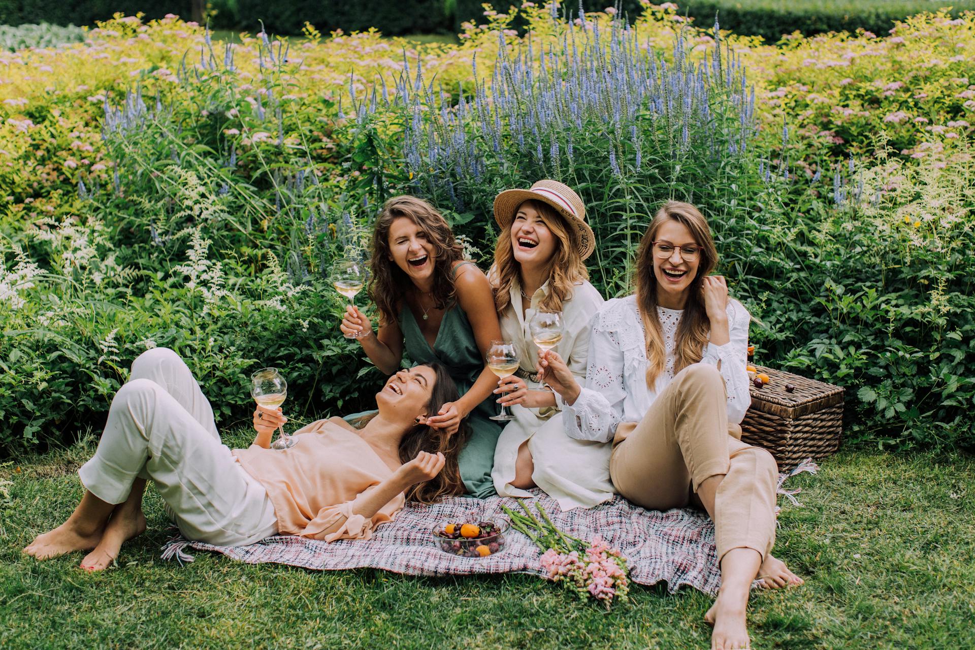 Women Sitting on Green Field
