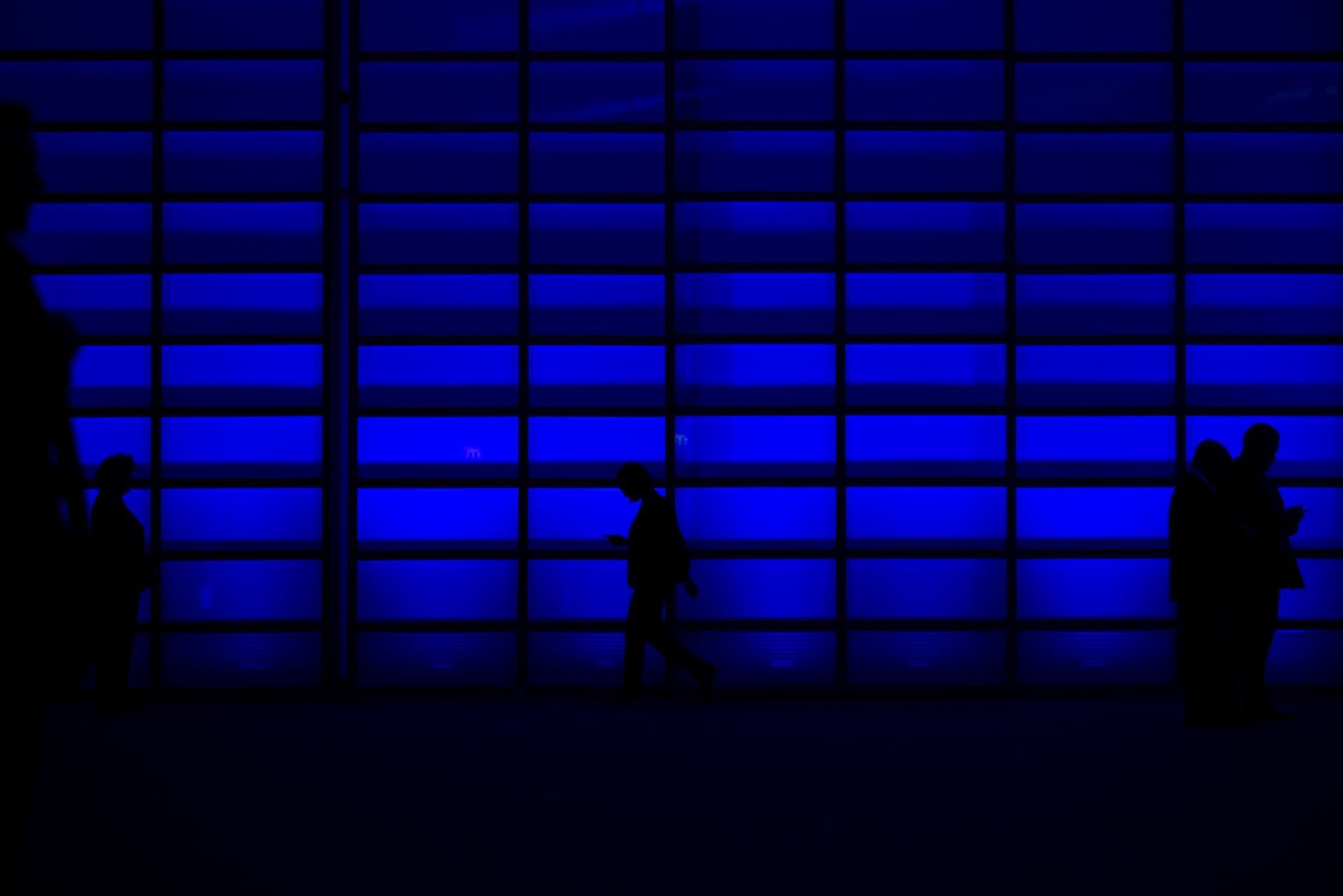 Silhouettes of people walking