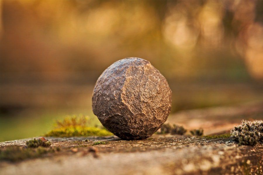 An image of a ball shaped rock (Dwayne Johnson)