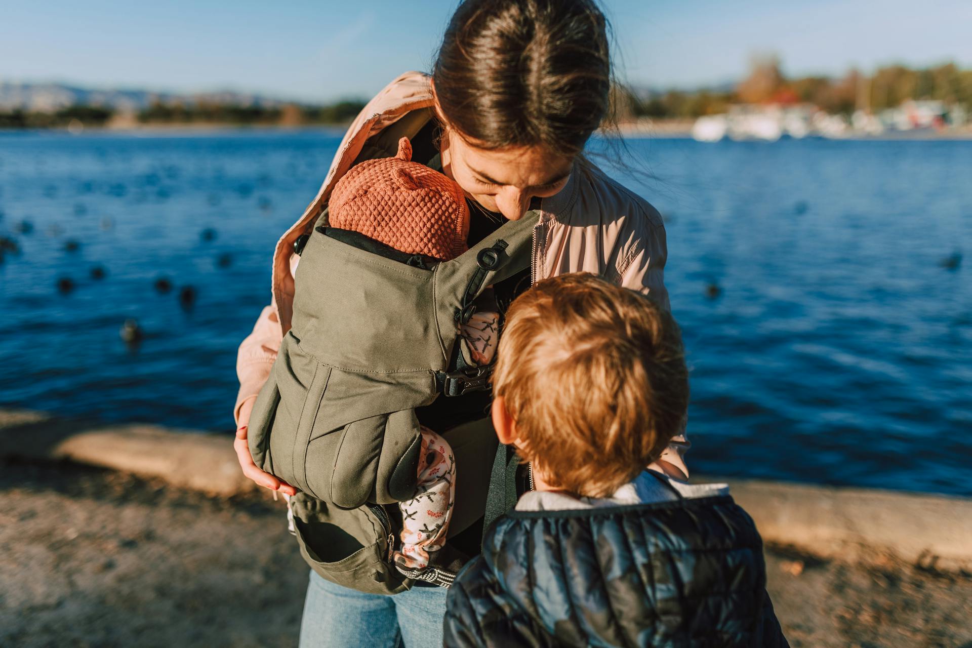 A Woman Carrying Her Baby