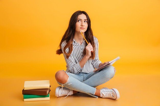 young girl learning, taking notes and preparing herself for the future