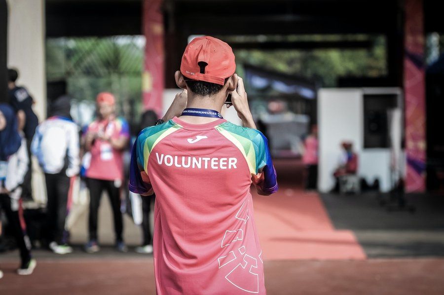 Back shot of a volunteer (Volunteerism)