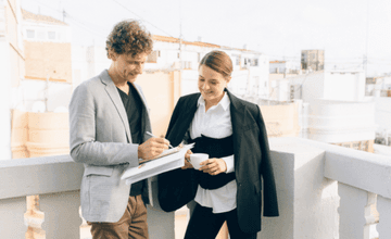 Man and Woman Discussing Work