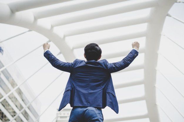 man in suit celebrating success