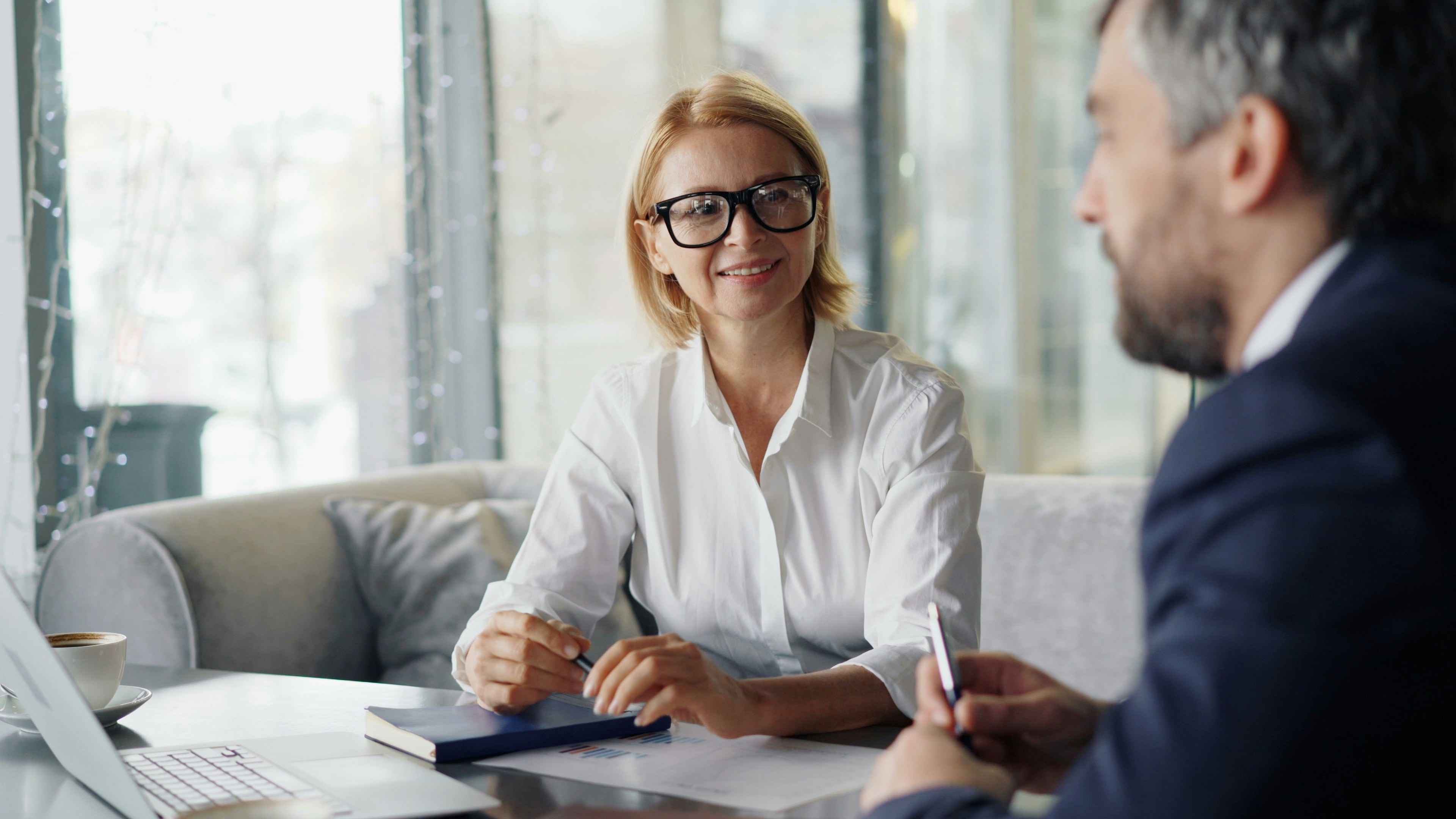 businesswoman and businessman chatting