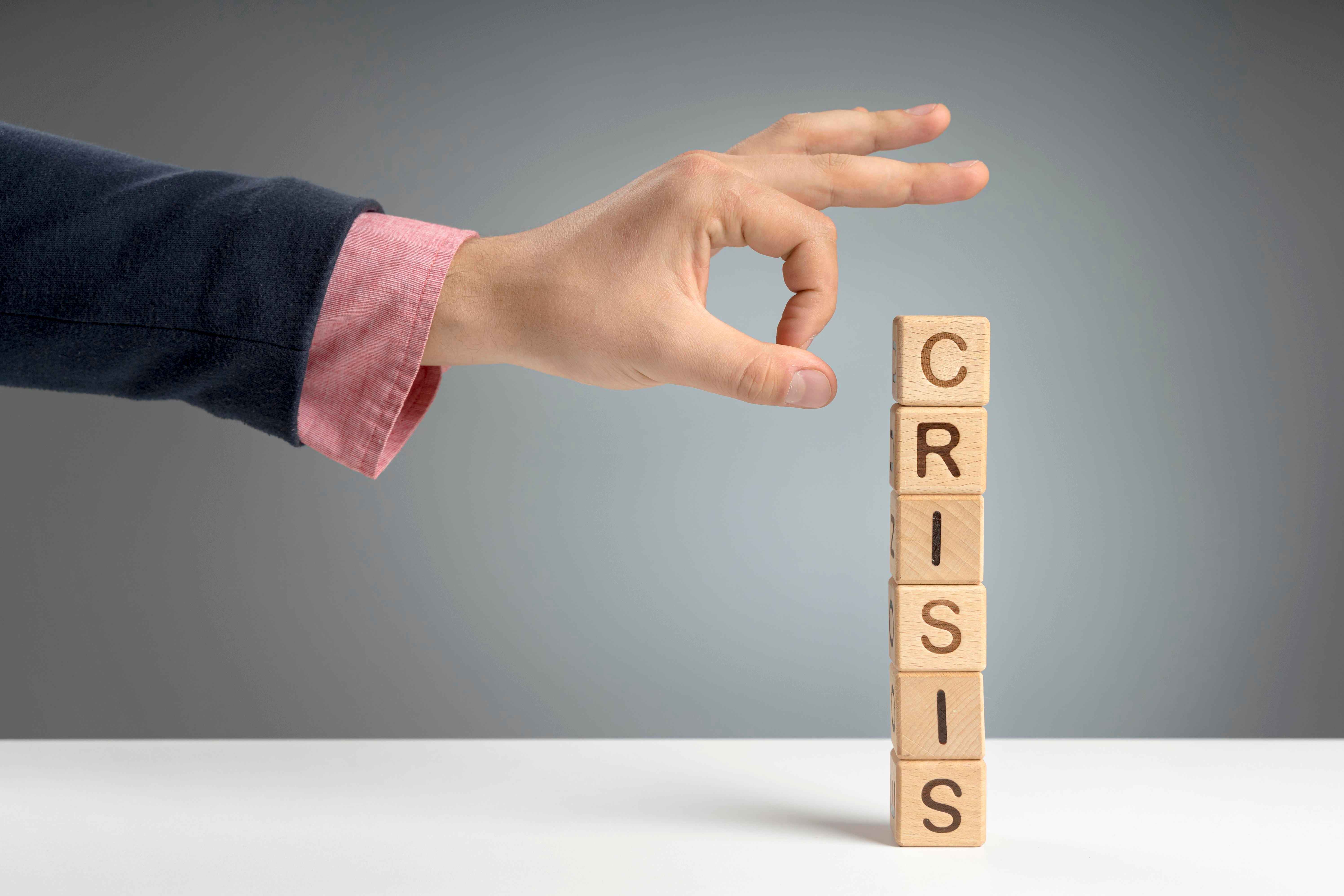 crisis message on wooden blocks